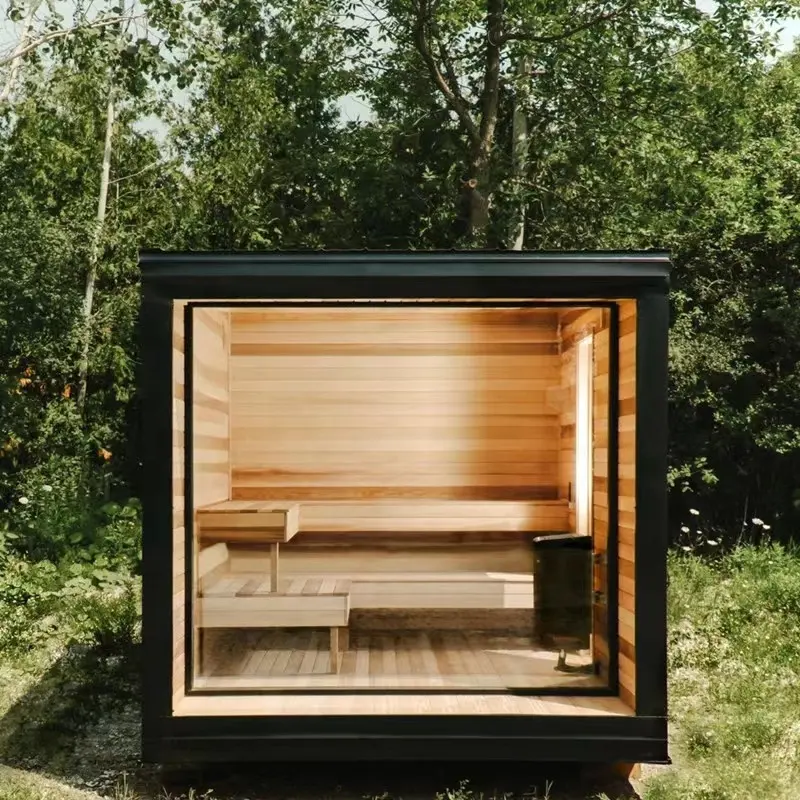 Black outdoor sauna and cold plunge. perfect for any backyard