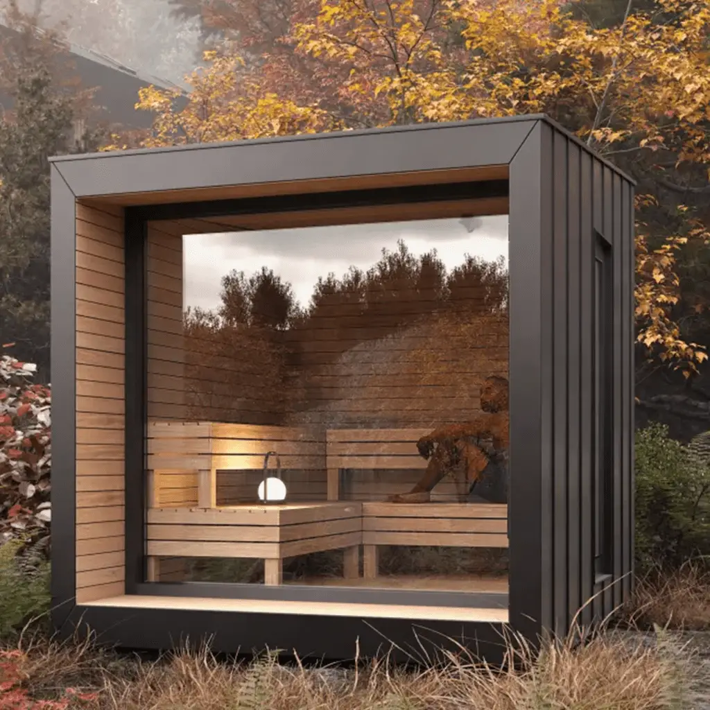 an incredible sauna in a fall outdoor background with a man inside ready for a cold plunge